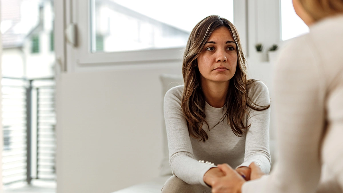 Woman Speaking with Therapist