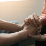 Two people holding hands.