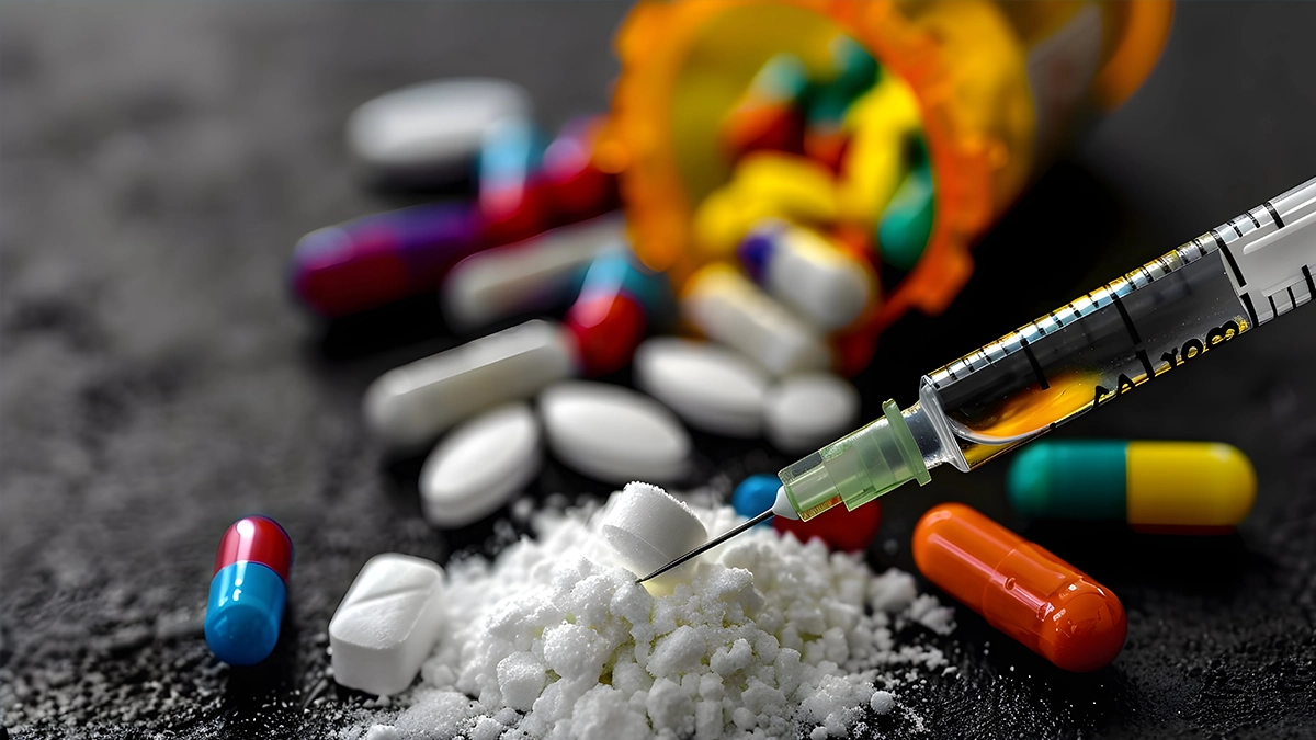 image depicting various forms of drugs, including pills, powder, and a syringe.