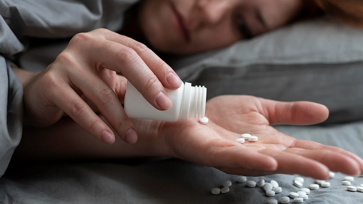 pills being poured into a hand